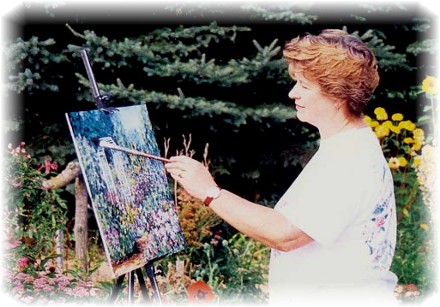 Elaine Tweedy painting in the arbor